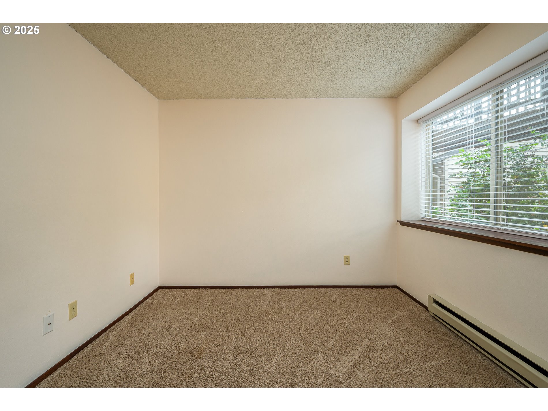 14828 Southwest 109th Avenue Portland, OR 97224 - Photo 23 of 40 an empty room with wooden floor and windows