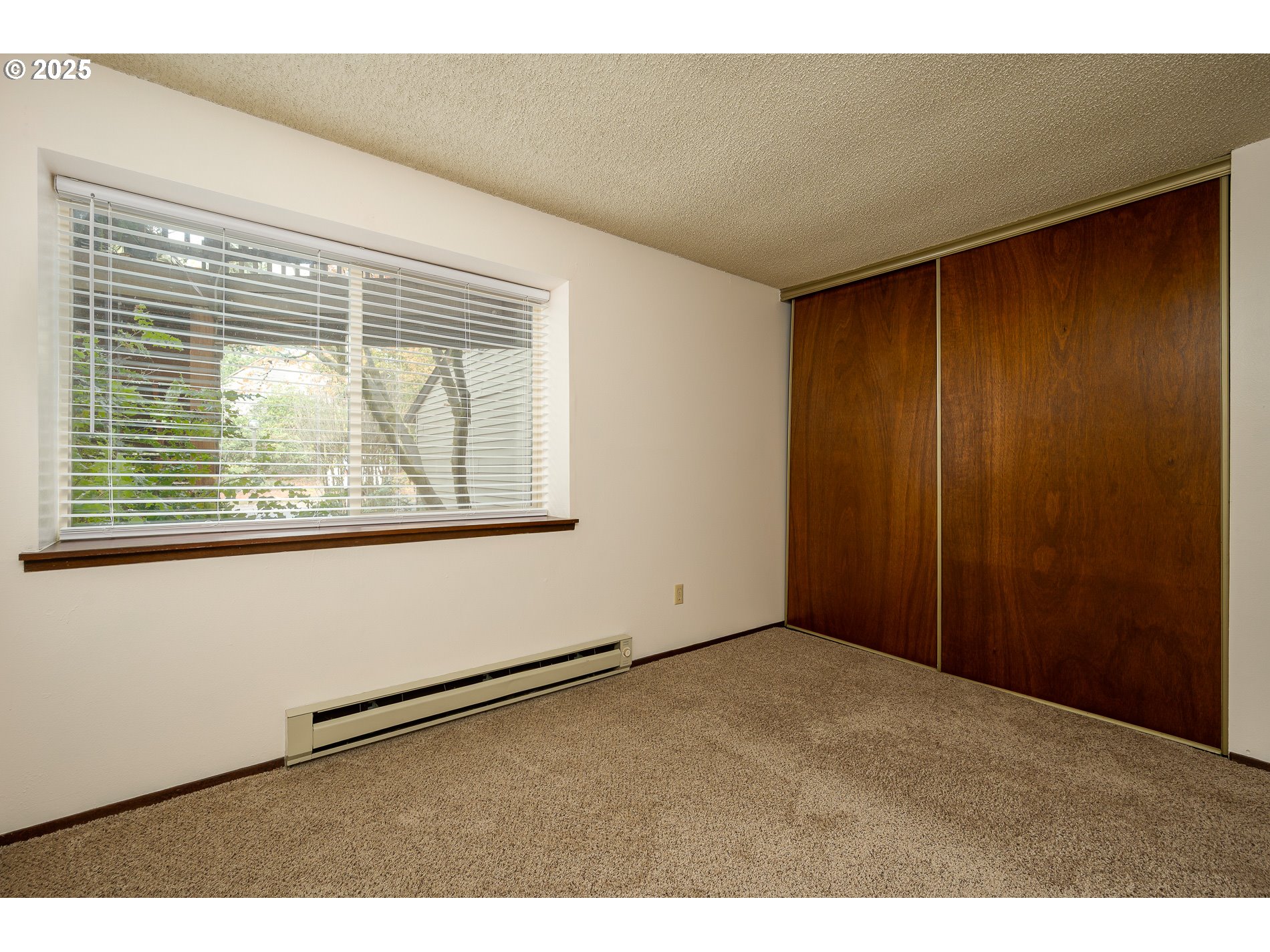 14828 Southwest 109th Avenue Portland, OR 97224 - Photo 24 of 40 a view of an empty room with a window
