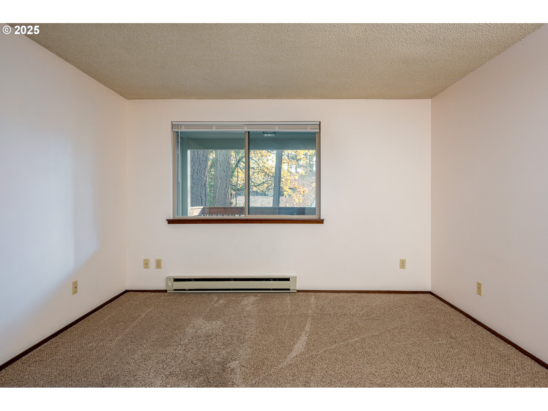 14828 Southwest 109th Avenue Portland, OR 97224 - Photo 26 of 40 an empty room with wooden floor and windows