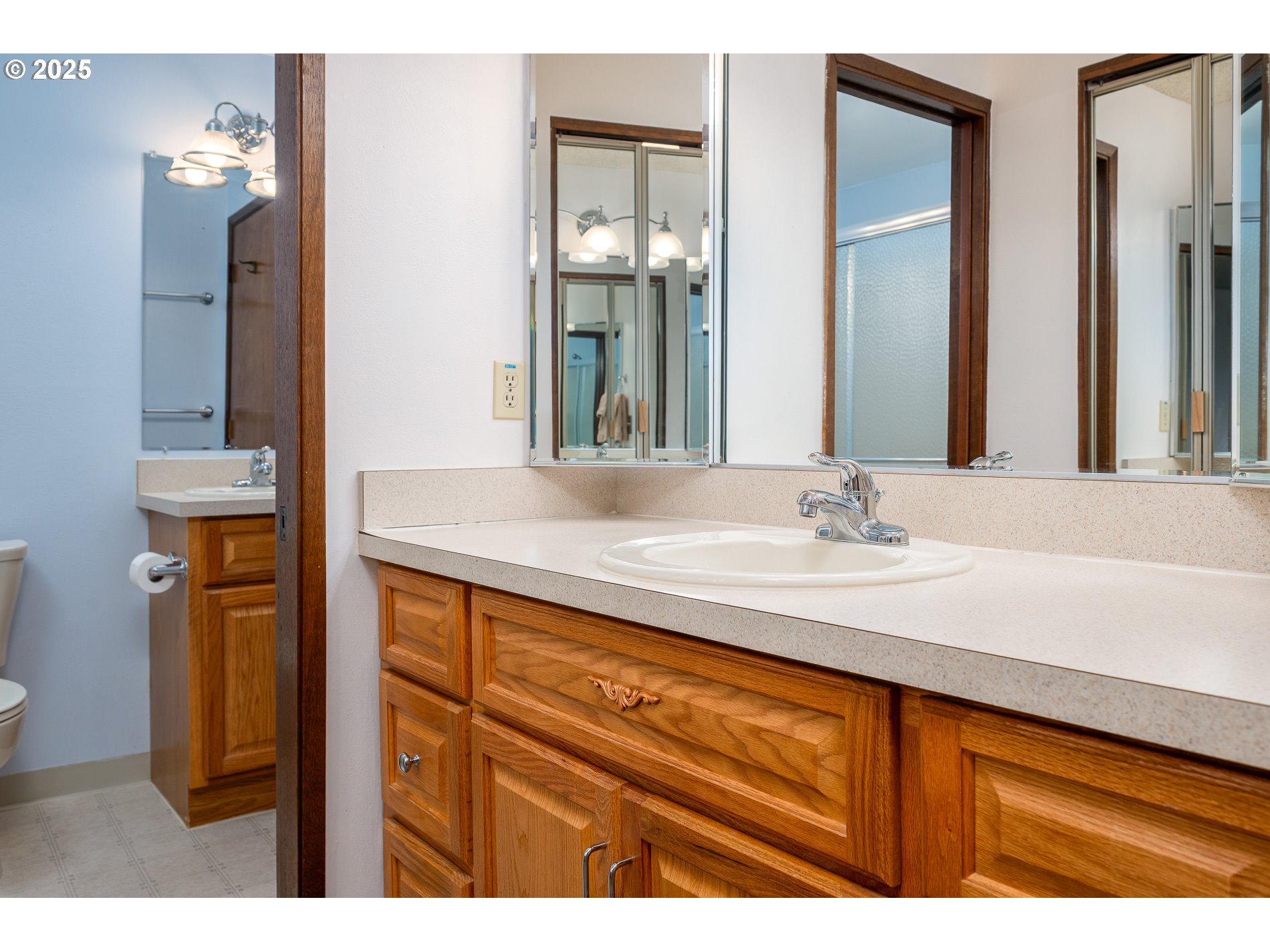 14828 Southwest 109th Avenue Portland, OR 97224 - Photo 29 of 40 a bathroom with a sink and a mirror