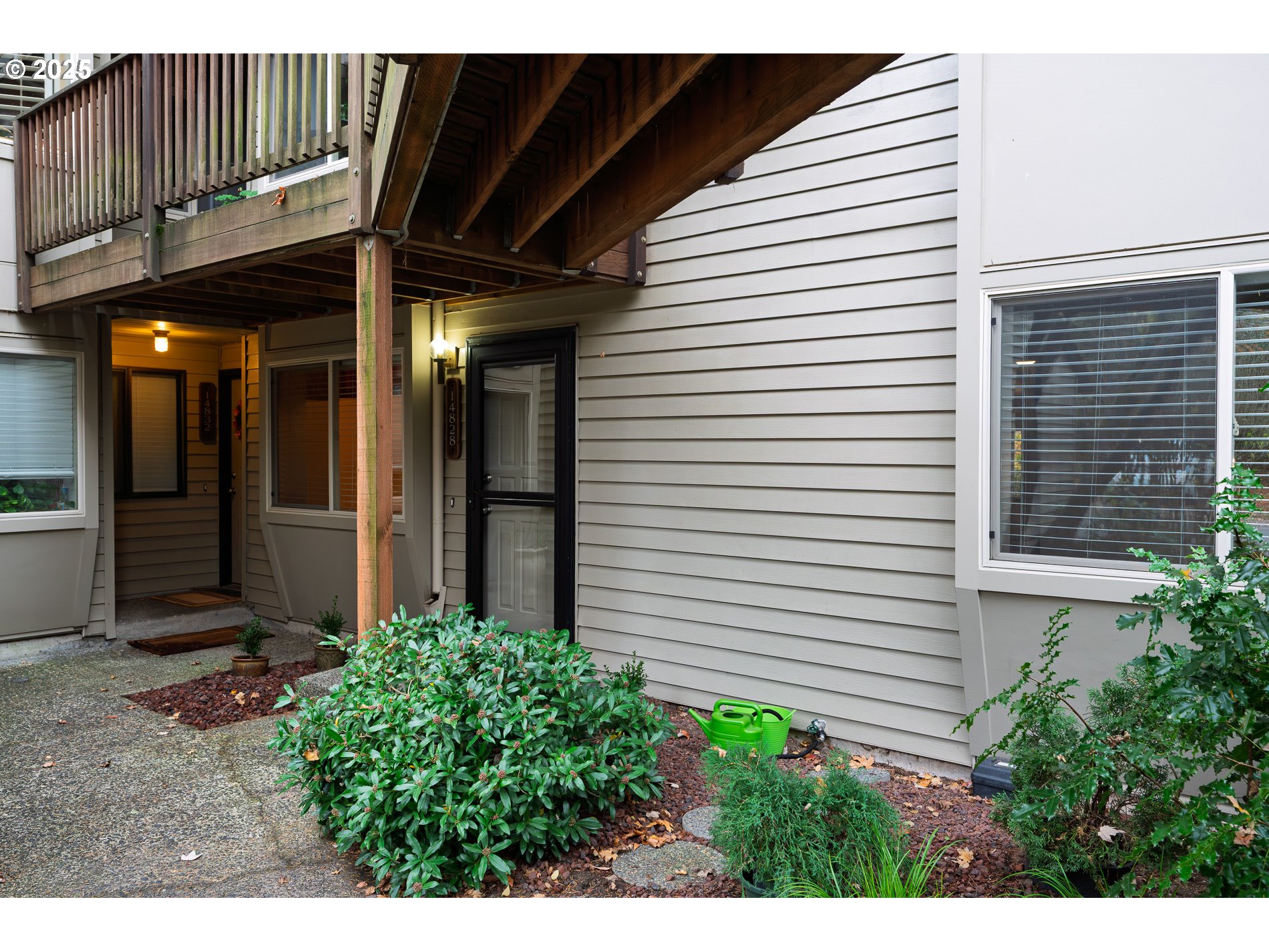 14828 Southwest 109th Avenue Portland, OR 97224 - Photo 40 of 40 a view of a house with a large window and yard