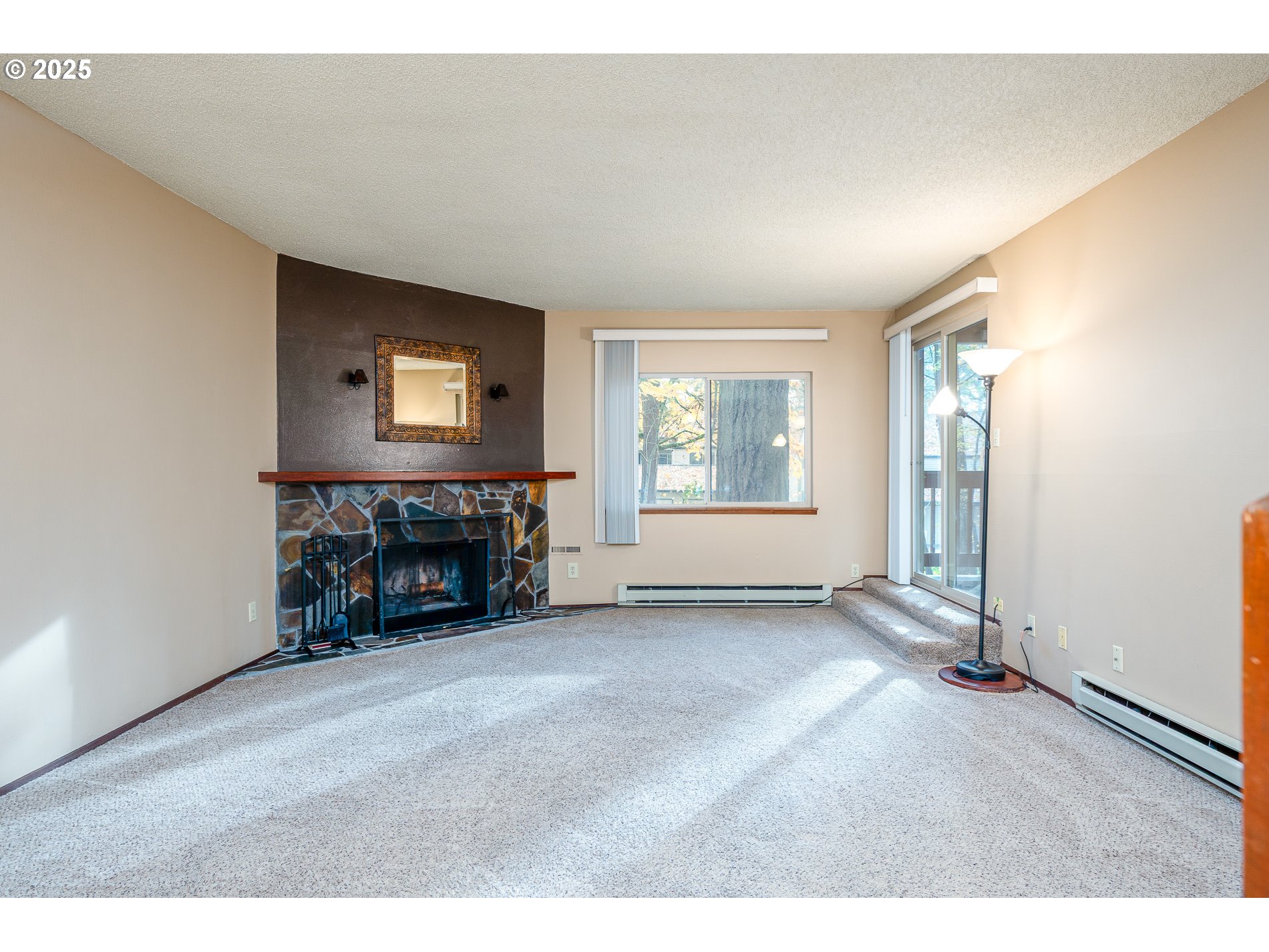 14828 Southwest 109th Avenue Portland, OR 97224 - Photo 8 of 40 an empty room with furniture and a fireplace