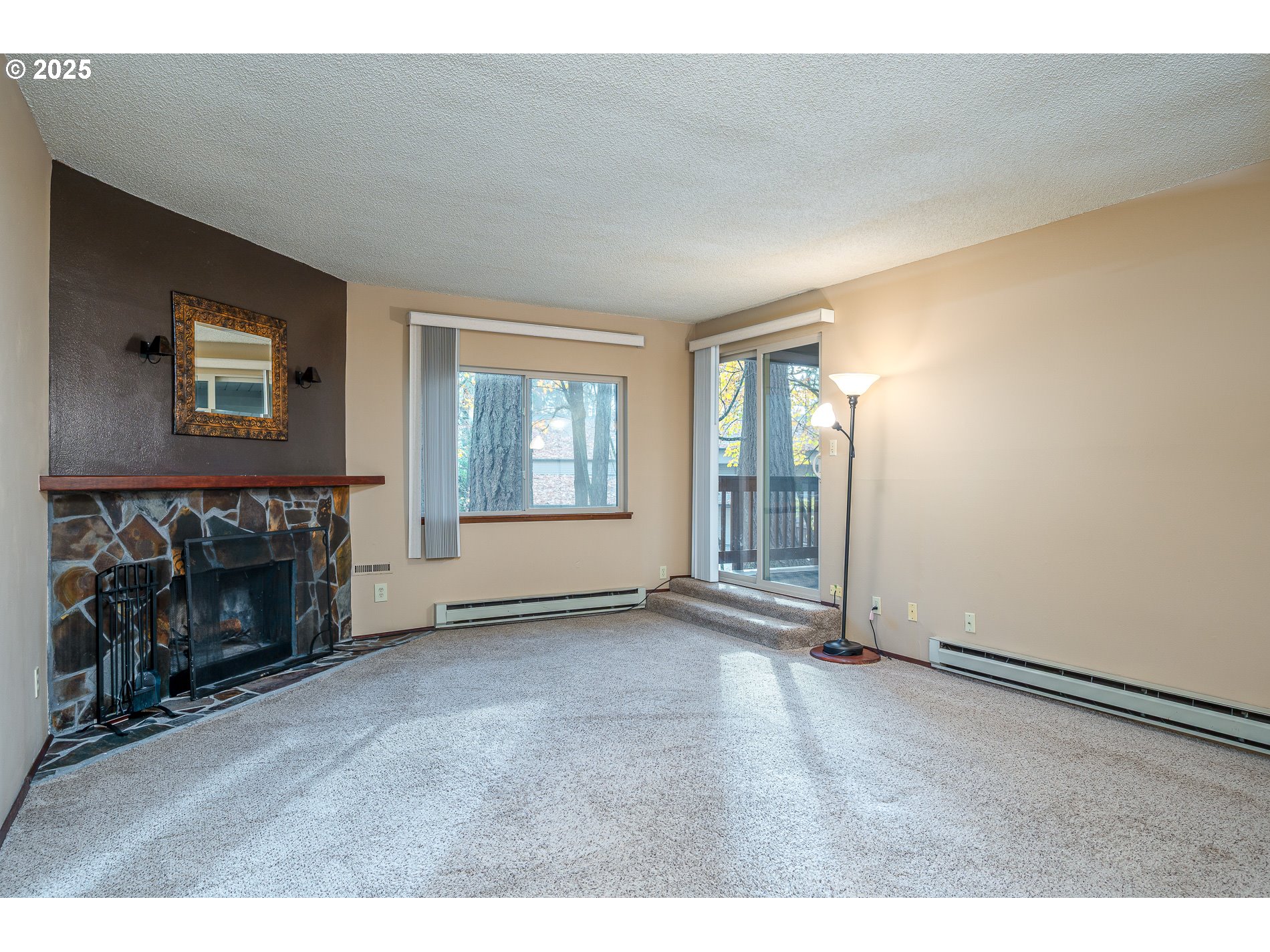 14828 Southwest 109th Avenue Portland, OR 97224 - Photo 9 of 40 an empty room with windows and fireplace