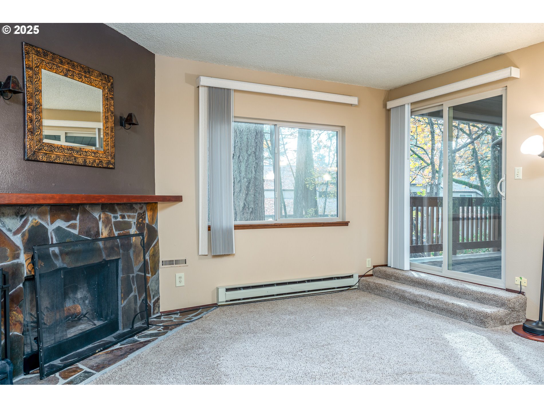 14828 Southwest 109th Avenue Portland, OR 97224 - Photo 10 of 40 a living room with window and a fireplace