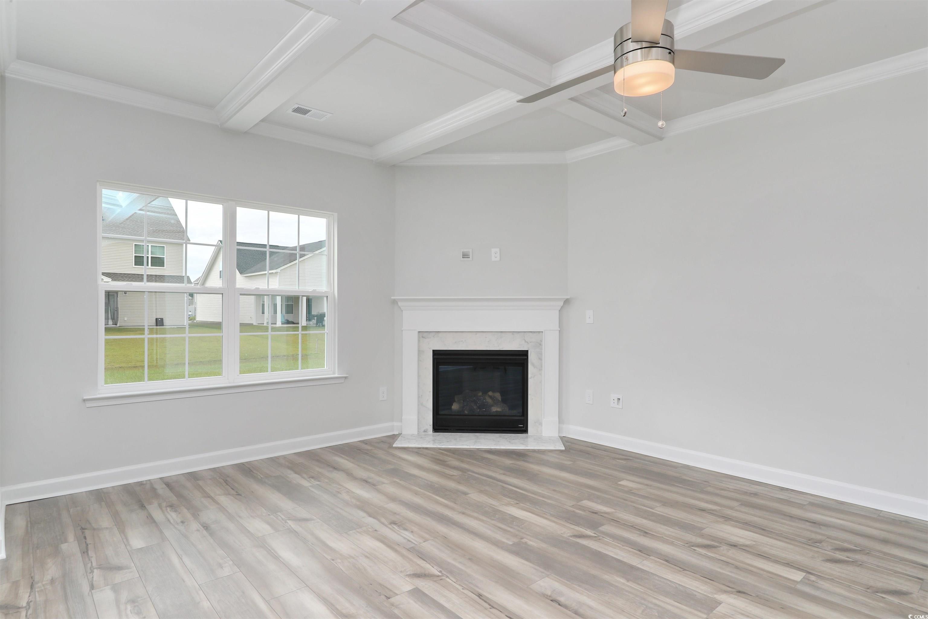 127 Azure Loop Myrtle Beach, SC 29588 - Photo 15 of 39 Unfurnished living room featuring coffered ceiling