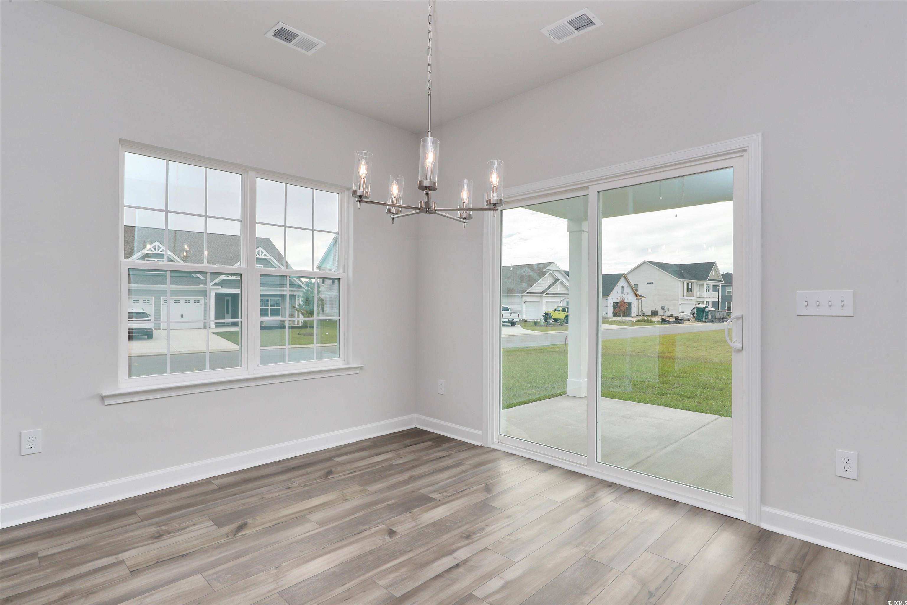 127 Azure Loop Myrtle Beach, SC 29588 - Photo 19 of 39 Unfurnished dining area featuring an inviting chan