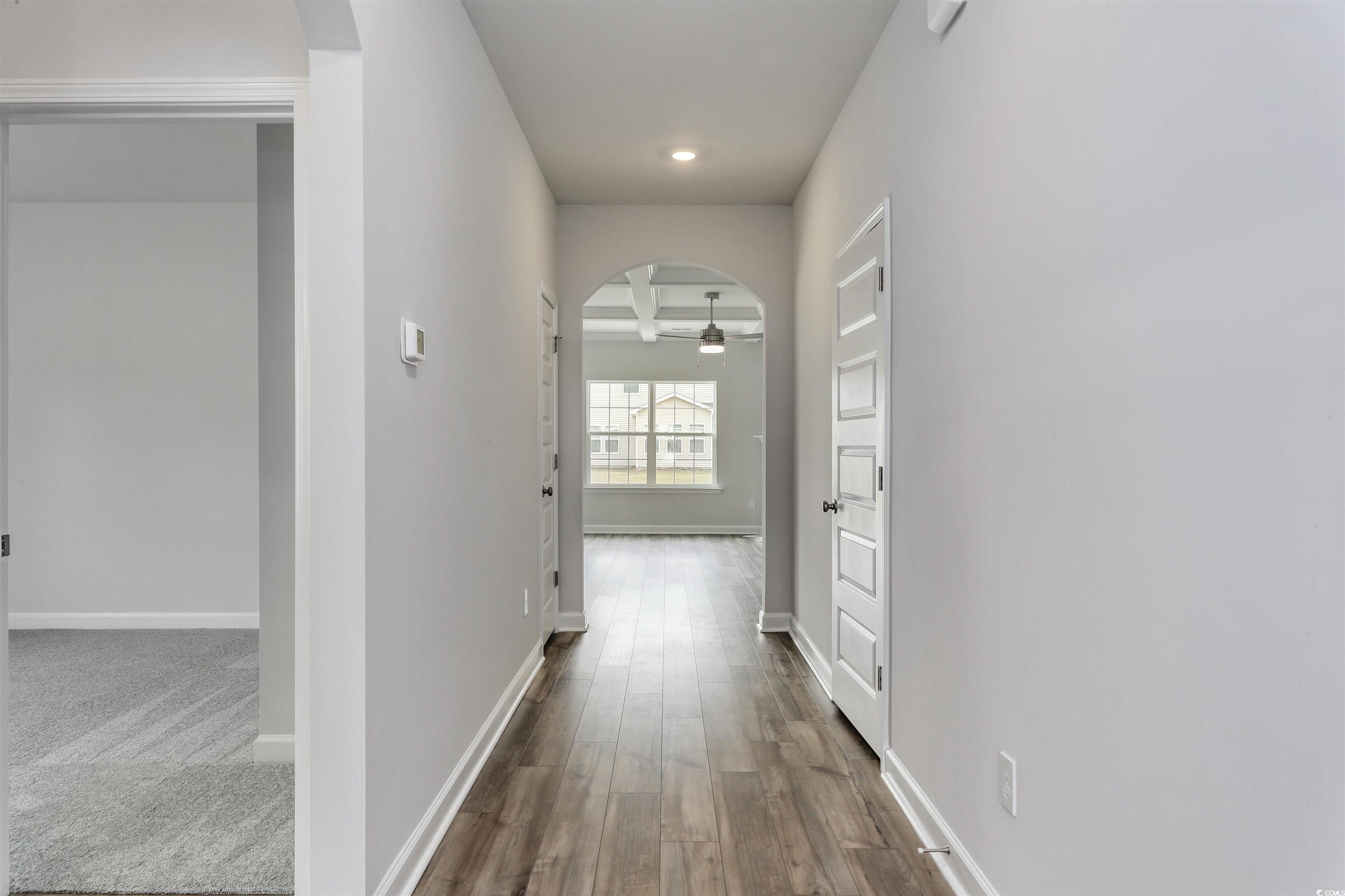 127 Azure Loop Myrtle Beach, SC 29588 - Photo 6 of 39 Hall with beam ceiling and hardwood / wood-style f