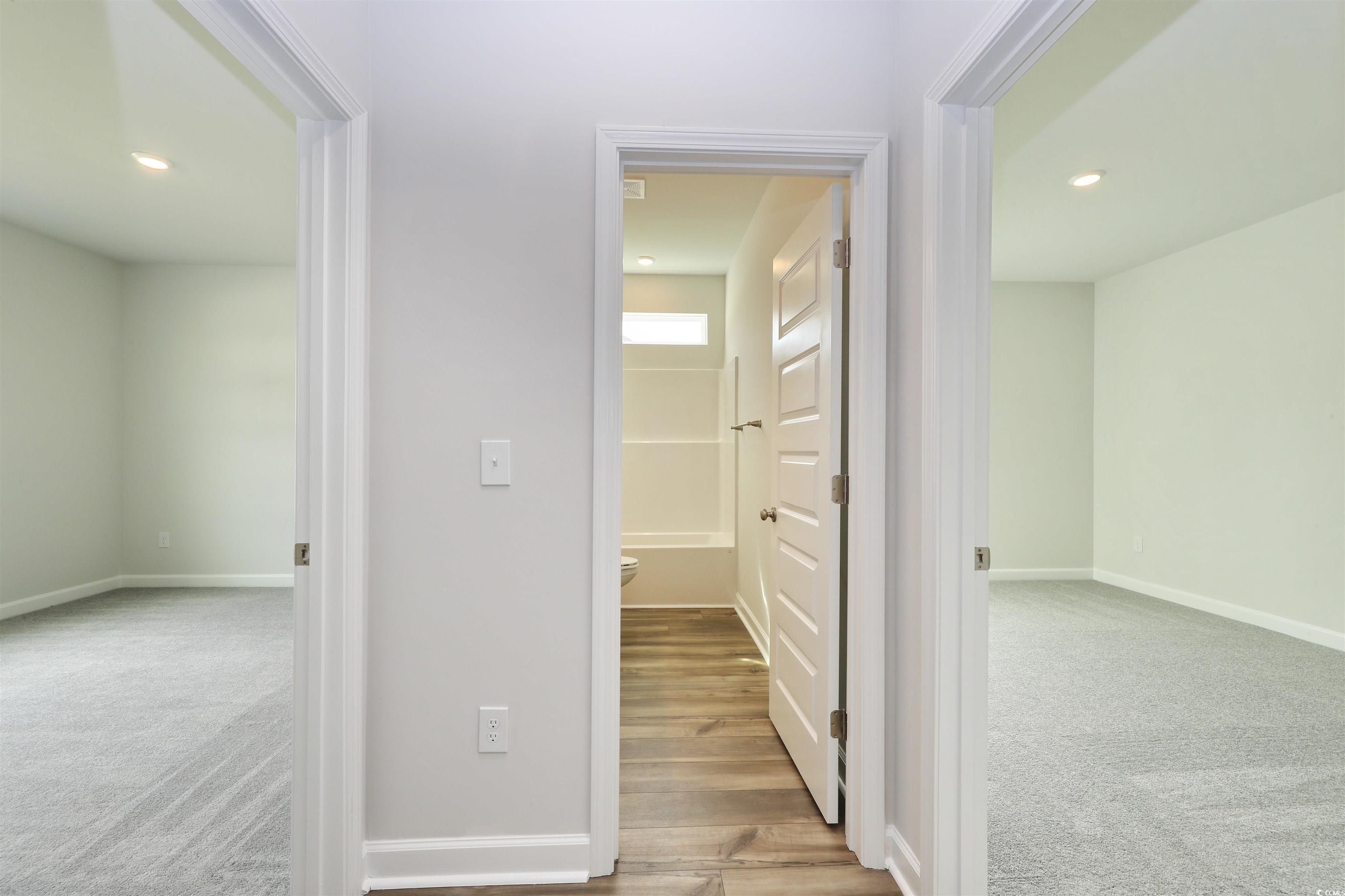 127 Azure Loop Myrtle Beach, SC 29588 - Photo 7 of 39 Hall with light carpet