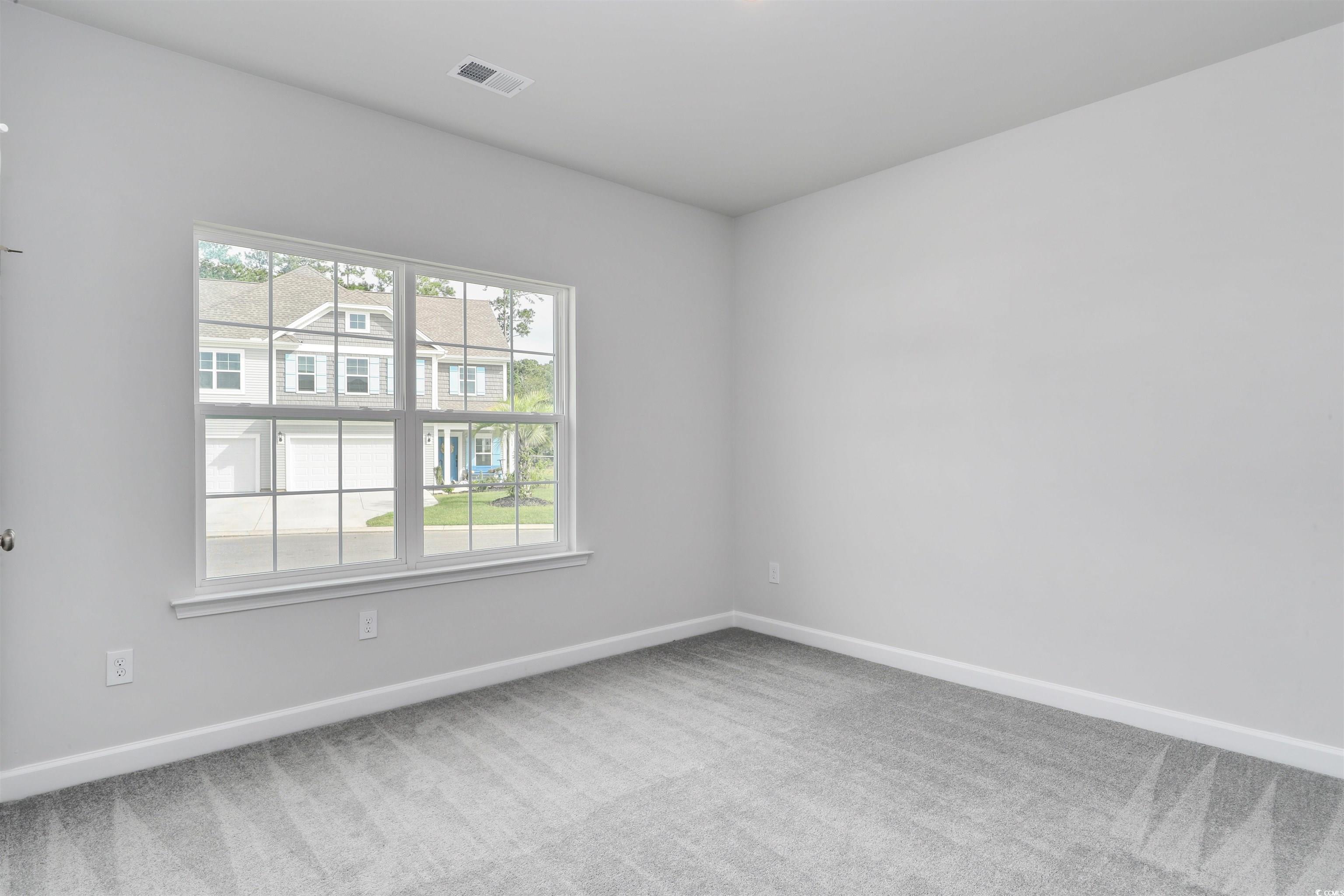 127 Azure Loop Myrtle Beach, SC 29588 - Photo 8 of 39 Empty room with carpet floors