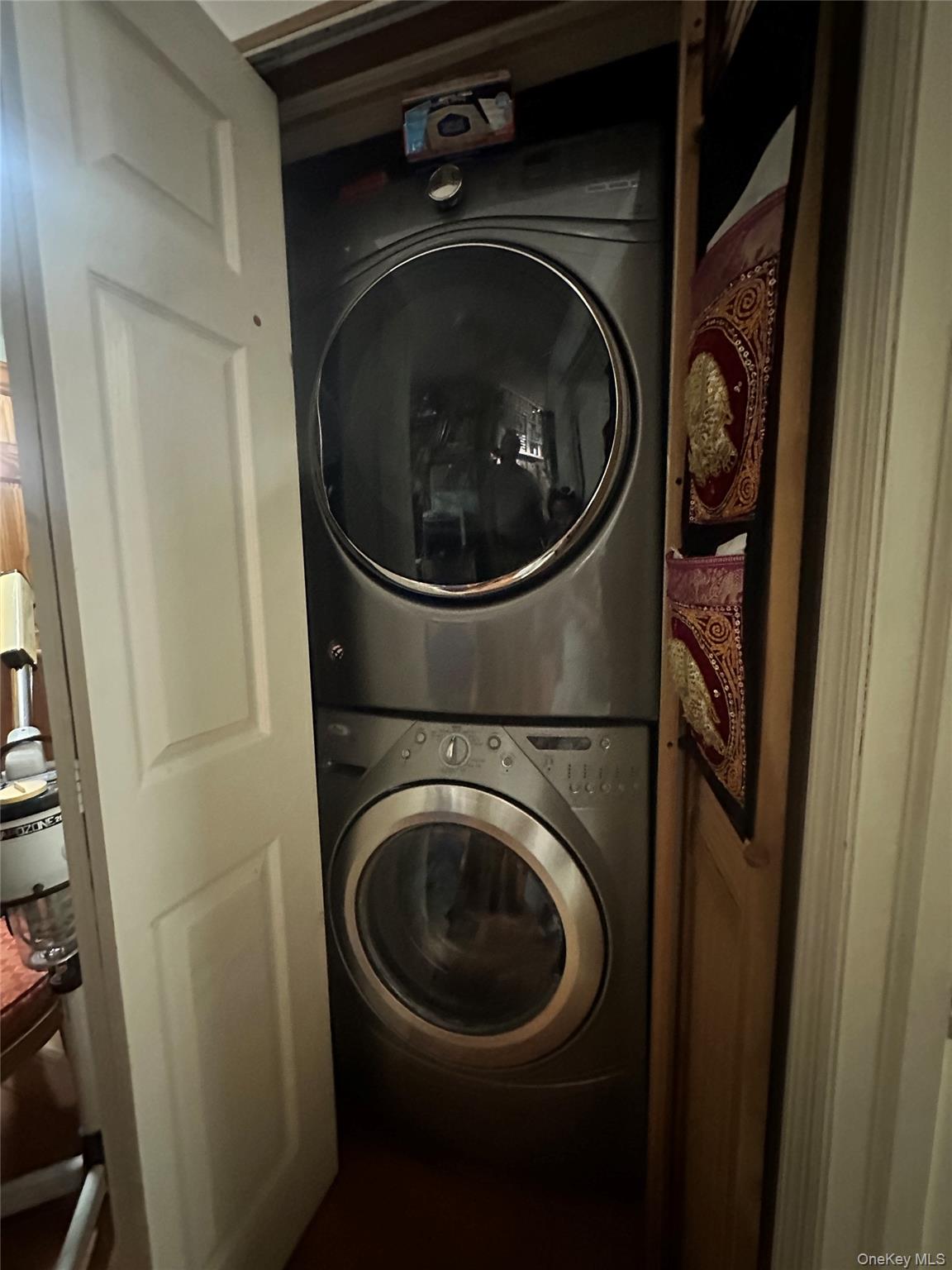 40-24 76th Street, Unit 3B Queens, NY 11373 - Photo 8 of 9 a utility room with dryer and washer