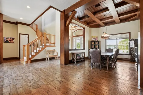a kitchen with stainless steel appliances granite countertop a sink a refrigerator and a stove