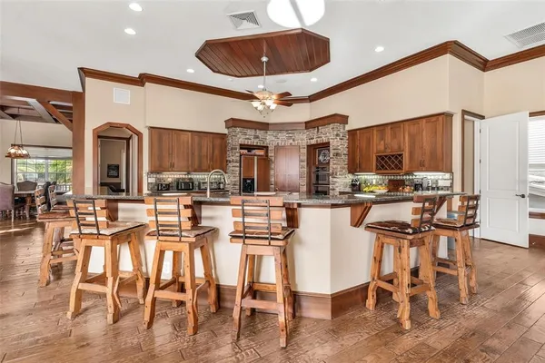 a view of entryway with wooden floor and windows