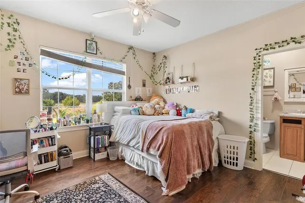 a living room with lots of furniture and painting on the wall