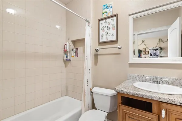 a bathroom with a shower and a mirror