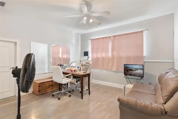 a view of a house with a yard and sitting area