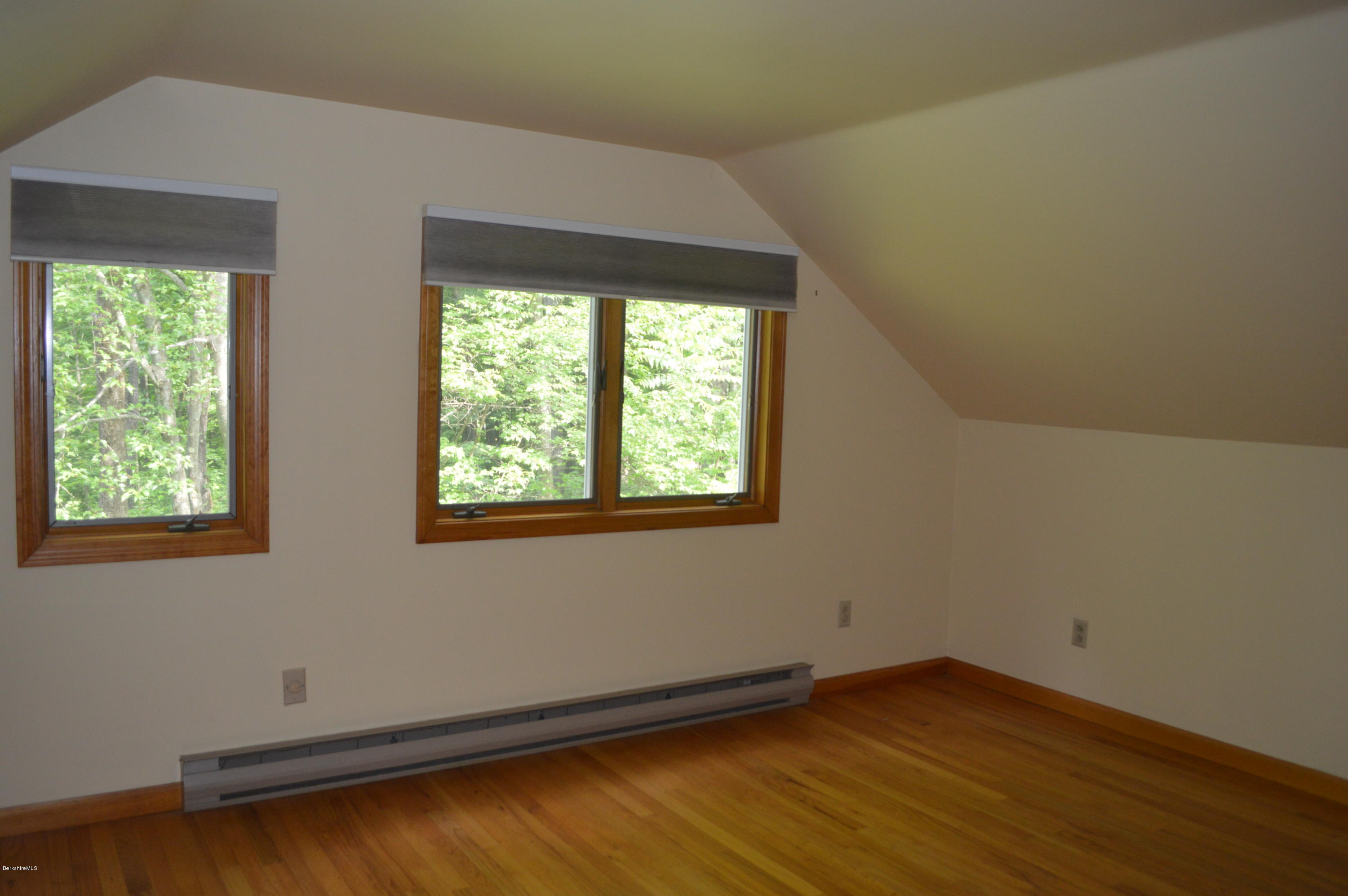 453 Summit Road Richmond, MA 01254 - Photo 14 of 25 an empty room with wooden floor and windows