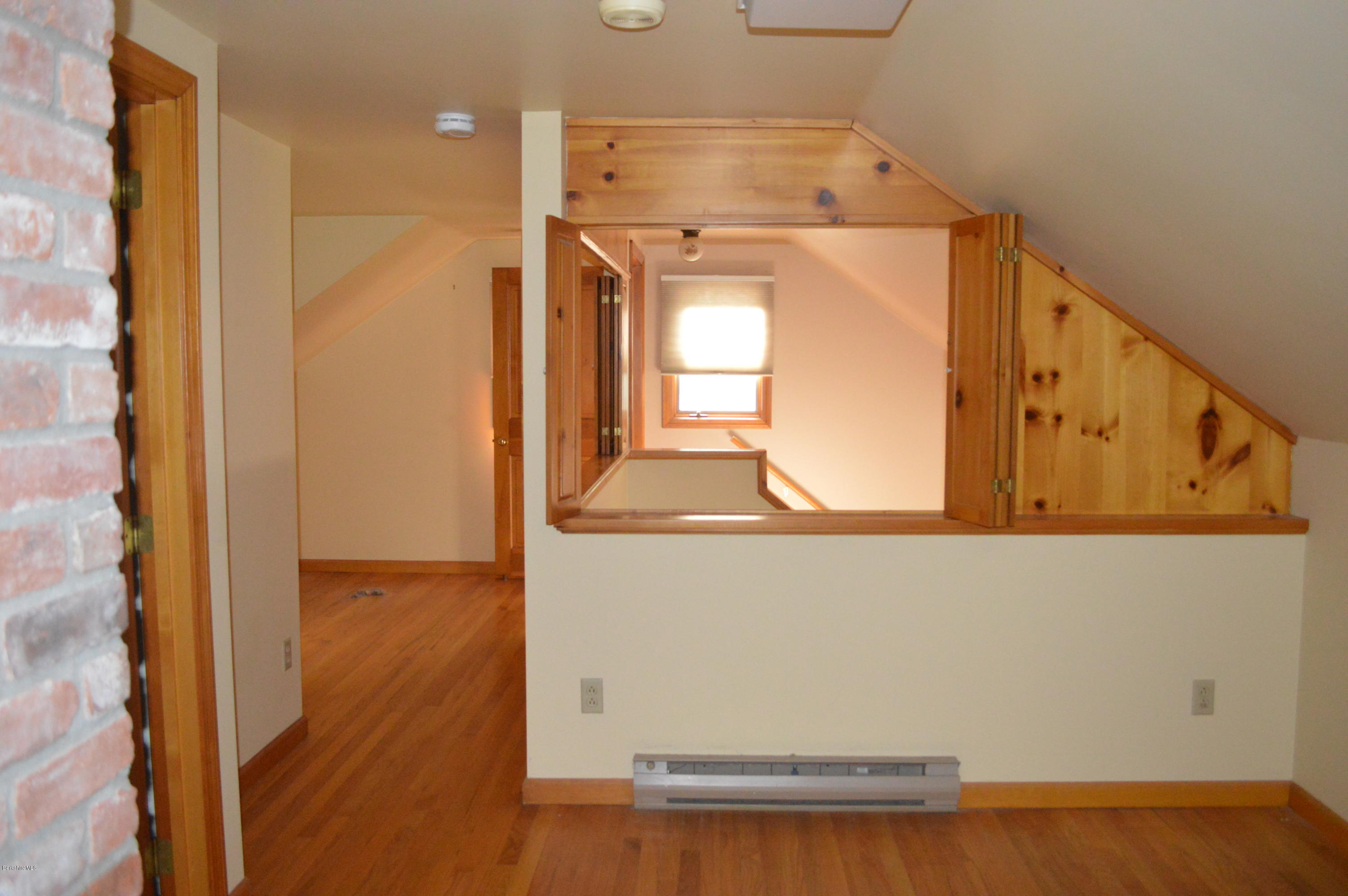 453 Summit Road Richmond, MA 01254 - Photo 16 of 25 a view of a hallway with wooden floor and cabinet