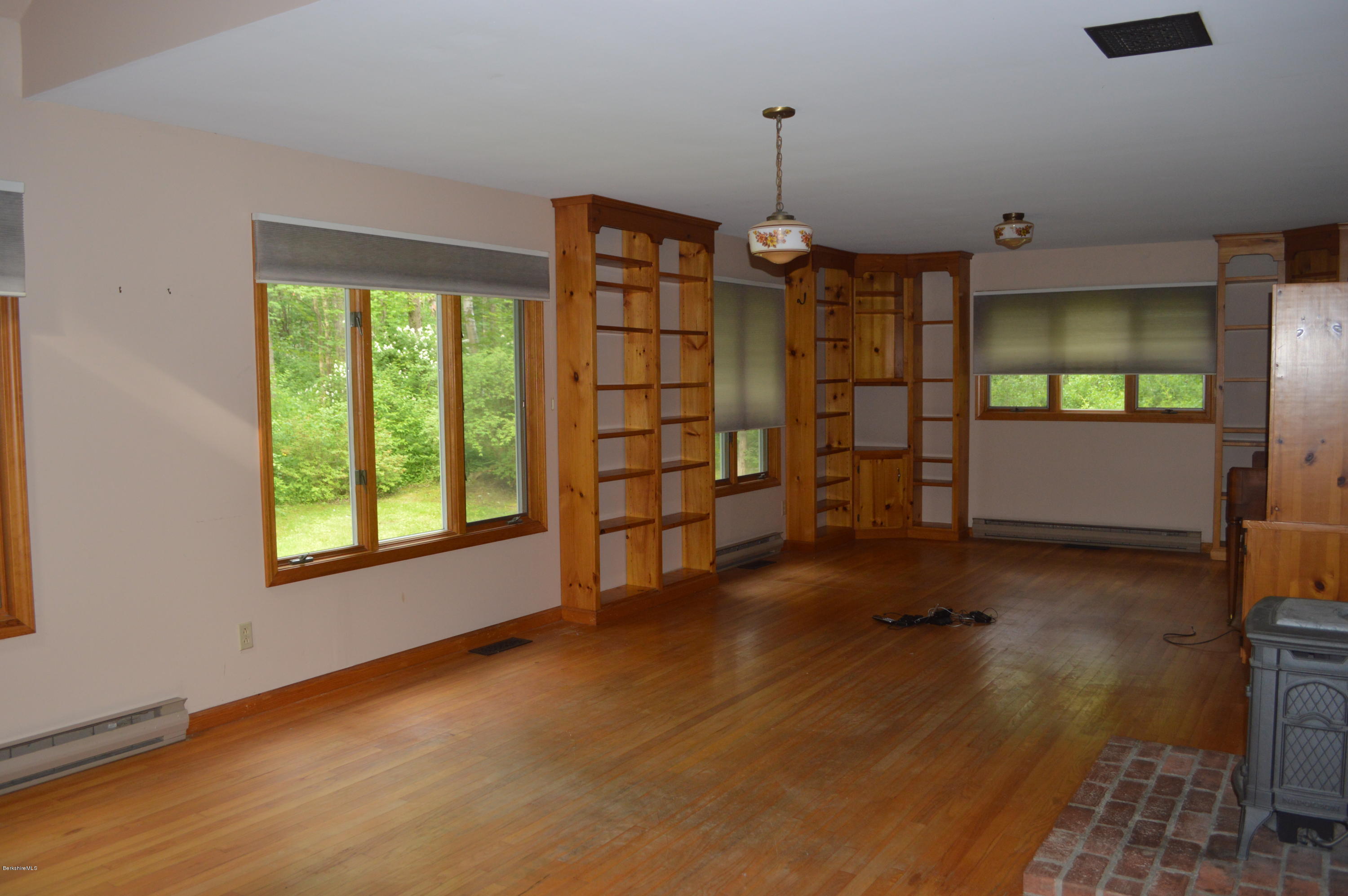 453 Summit Road Richmond, MA 01254 - Photo 3 of 25 a view of an empty room with a window
