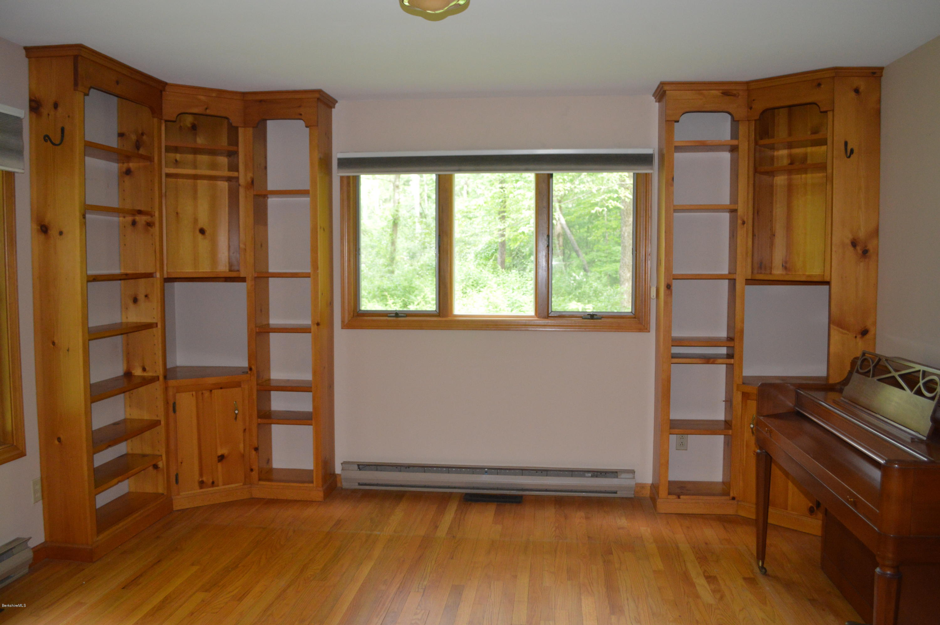 453 Summit Road Richmond, MA 01254 - Photo 5 of 25 a view of an empty room with wooden floor and a window