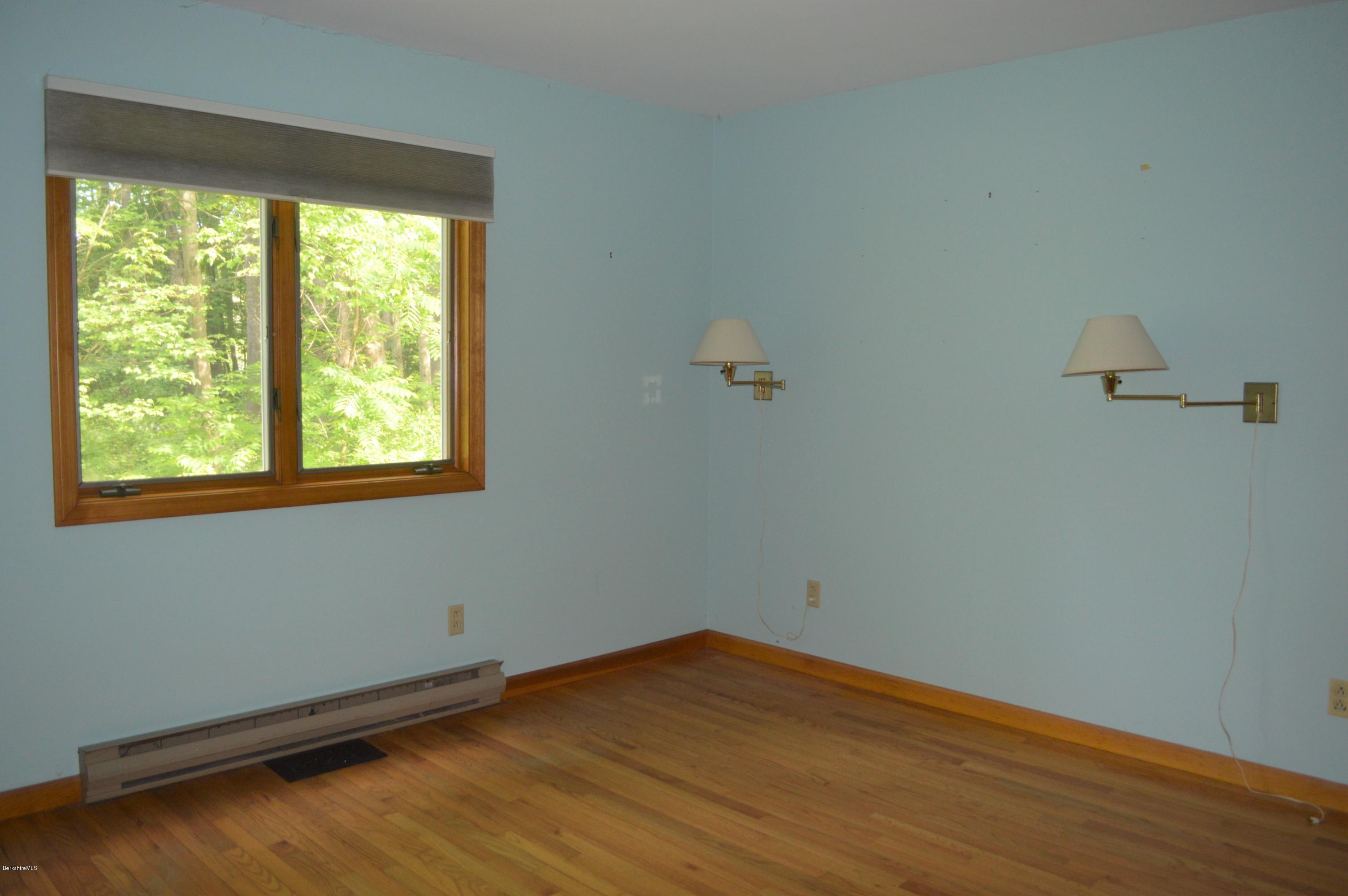 453 Summit Road Richmond, MA 01254 - Photo 10 of 25 a view of a room with wooden floor and windows