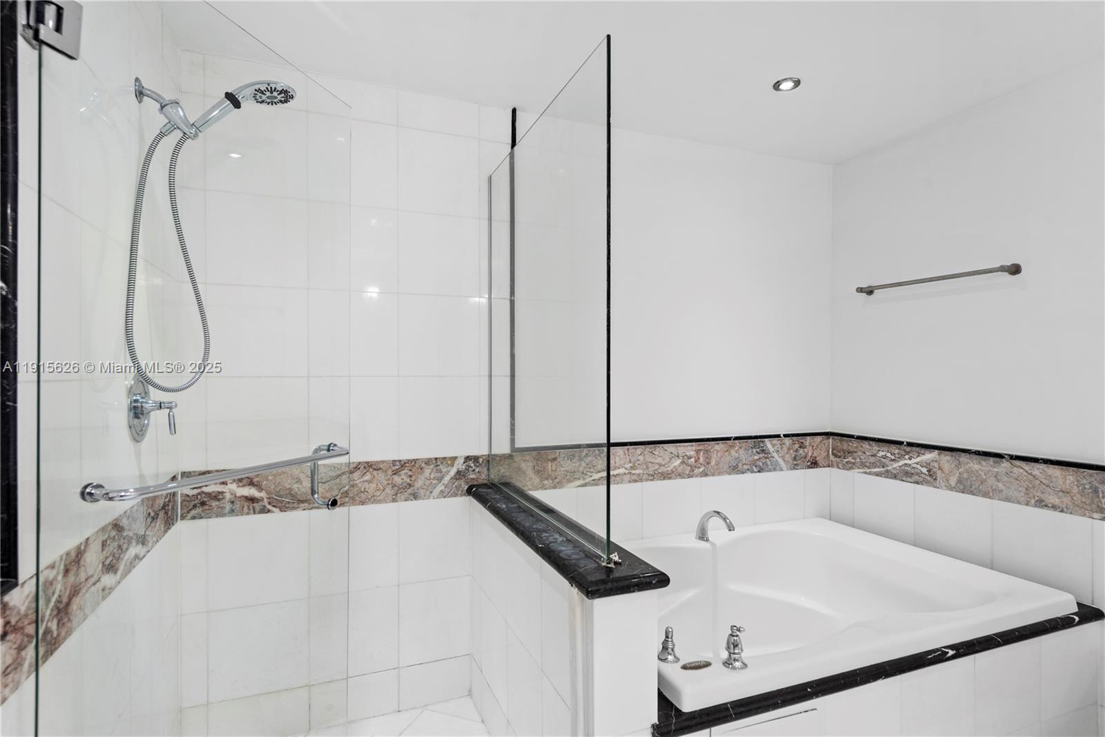 540 West Avenue, Unit 413 Miami Beach, FL 33139 - Photo 24 of 33 a bathroom with a sink and a shower