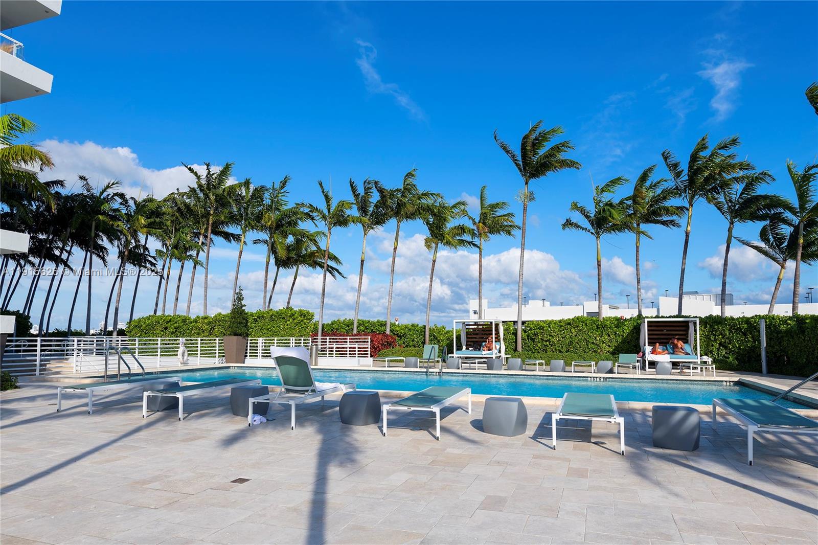 540 West Avenue, Unit 413 Miami Beach, FL 33139 - Photo 32 of 33 a view of swimming pool with a patio and a garden