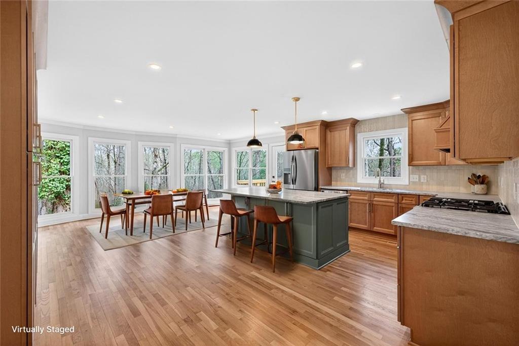 3110 Flatbottom Road Ball Ground, GA 30107 - Photo 17 of 89 a kitchen with lots of counter top space and dining table