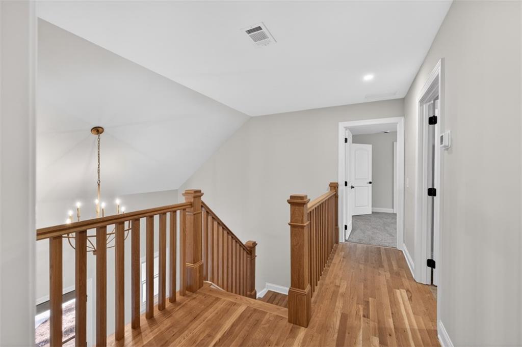 3110 Flatbottom Road Ball Ground, GA 30107 - Photo 40 of 89 a view of a hallway with wooden floor and staircase