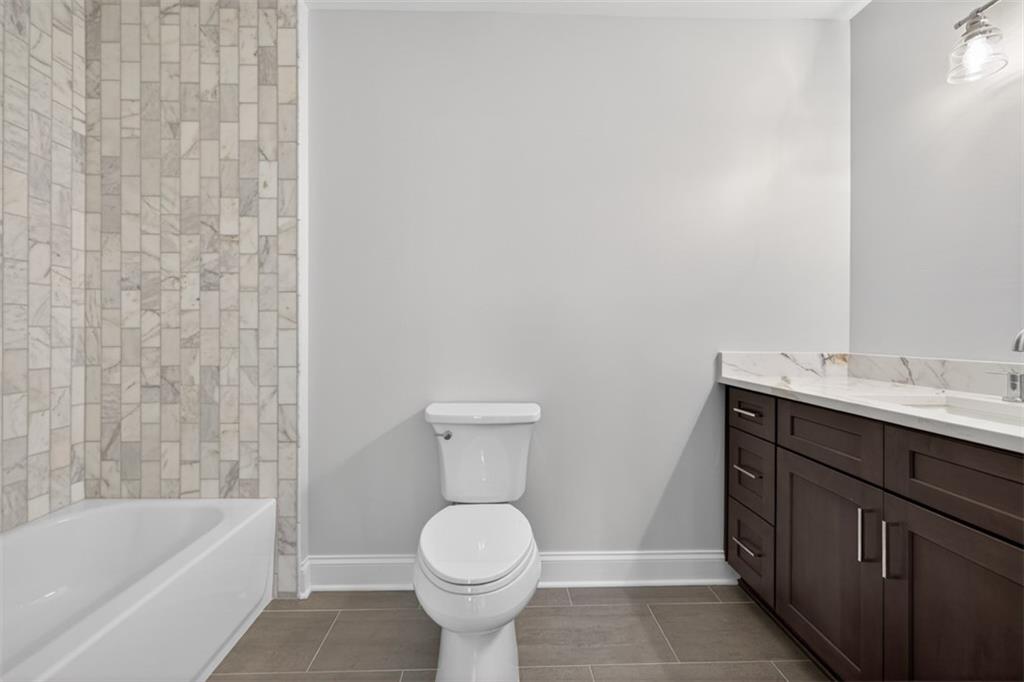 3110 Flatbottom Road Ball Ground, GA 30107 - Photo 45 of 89 a bathroom with a sink toilet and bathtub