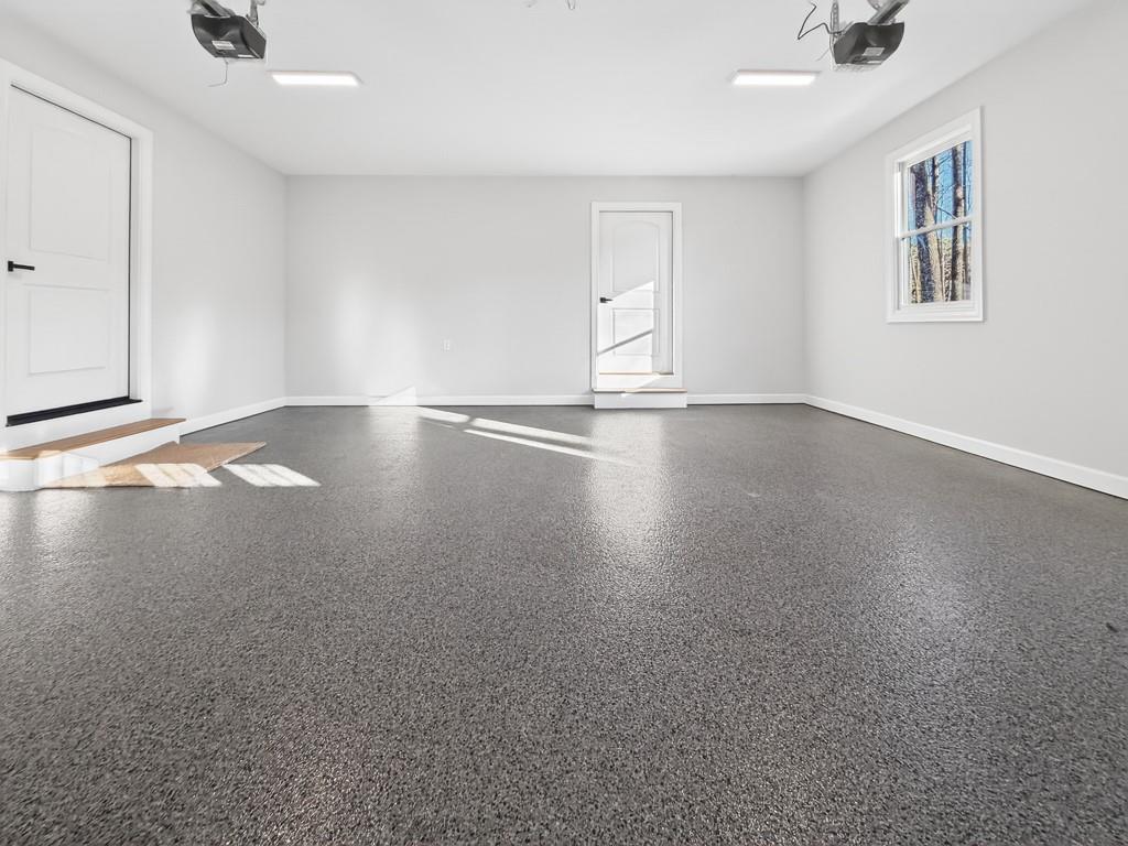 3110 Flatbottom Road Ball Ground, GA 30107 - Photo 80 of 89 wooden floor in an empty room with a window
