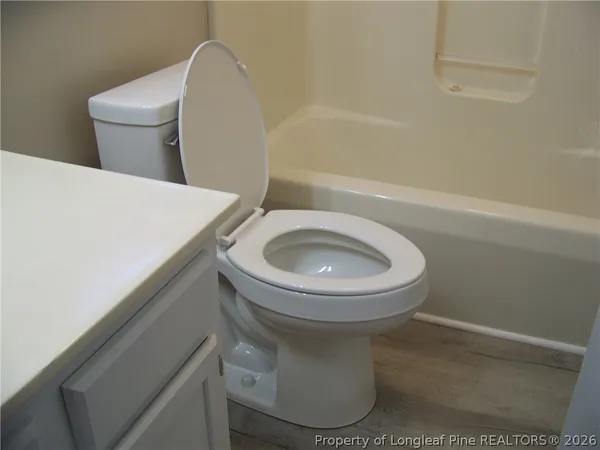 a bathroom with a toilet and a sink