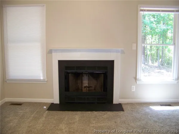 a living room with a fireplace in it