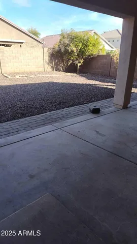 a view of a room with wooden floor and window