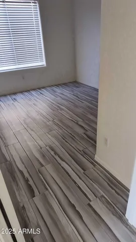 a view of wooden floor with staircase