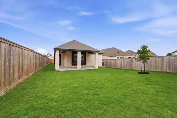 a backyard of a house with lots of green space