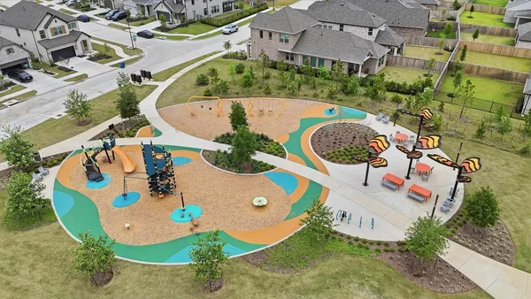 an aerial view of a house with a swimming pool