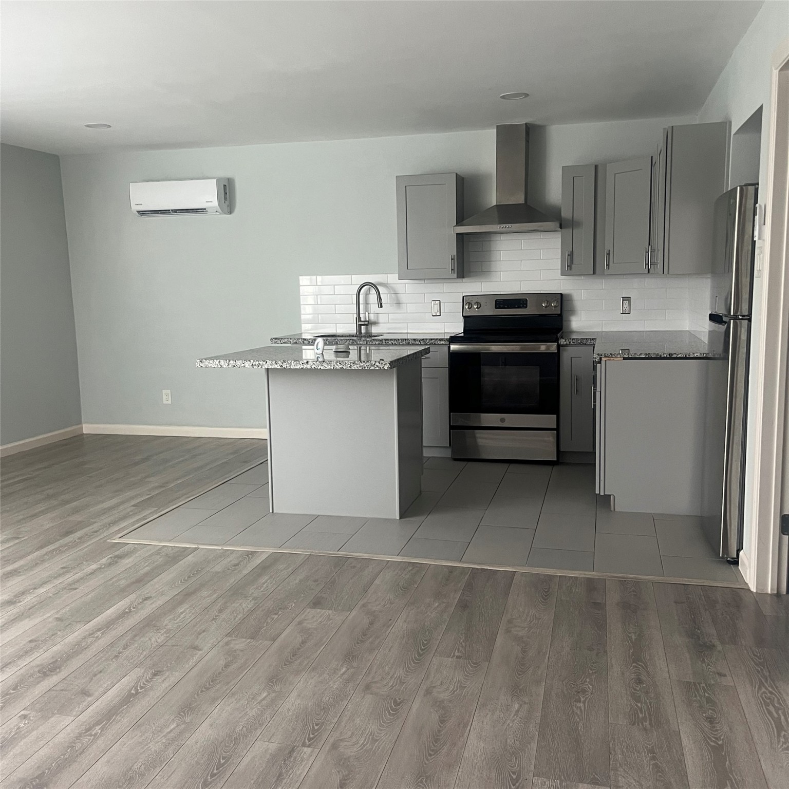 a kitchen with a sink cabinets and stainless steel appliances