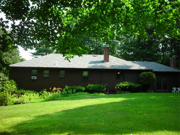 3 Greybirch Road Andover, MA 01810 - Photo 12 of 13 a front view of a house with garden