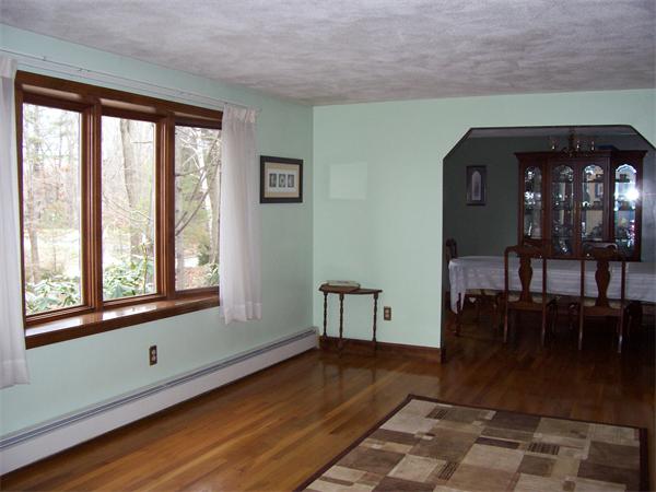 3 Greybirch Road Andover, MA 01810 - Photo 3 of 13 a view of empty room with wooden floor and fan