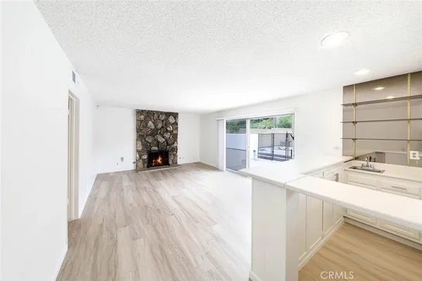 a kitchen with cabinets and appliances