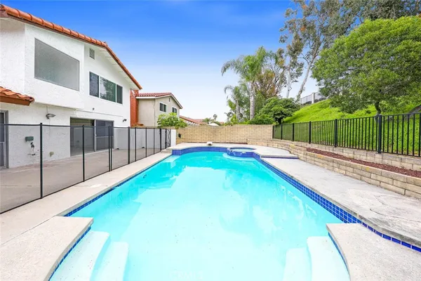 a view of swimming pool with a yard