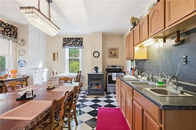 a kitchen with a sink stove and cabinets