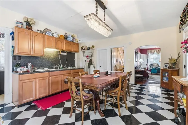 a view of a dining area with furniture and a chandelier