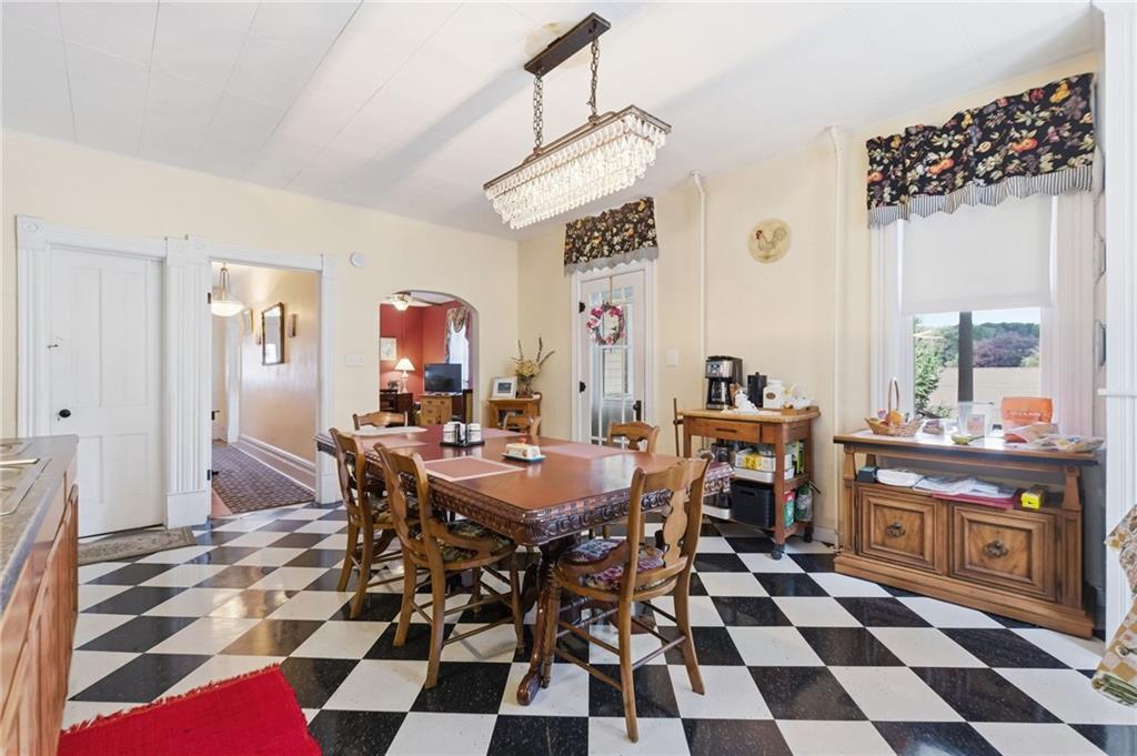 156 Rockdale Road Rockwood, PA 15557 - Photo 13 of 35 a view of a dining room and a black and white checkered floor