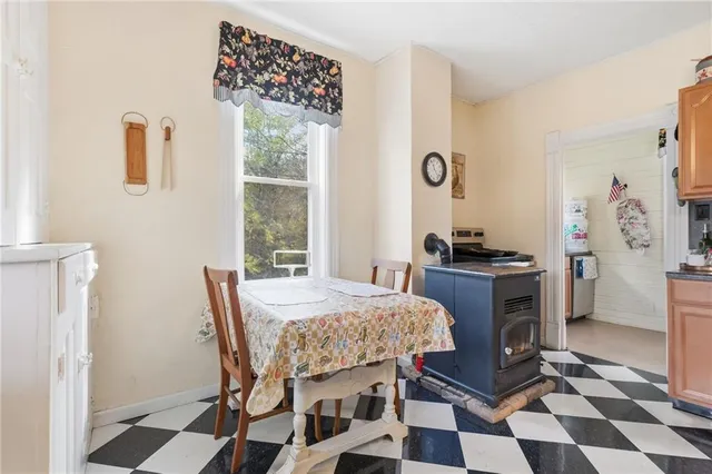 a dining room with furniture and window