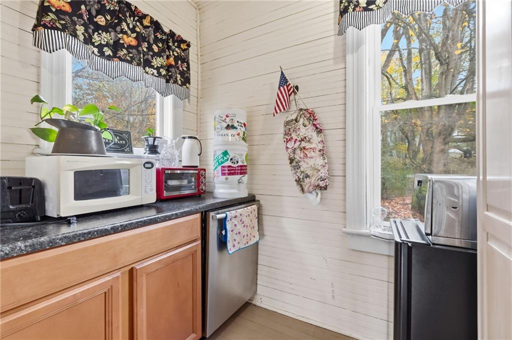 156 Rockdale Road Rockwood, PA 15557 - Photo 15 of 35 a kitchen with granite countertop a stove a sink and a microwave