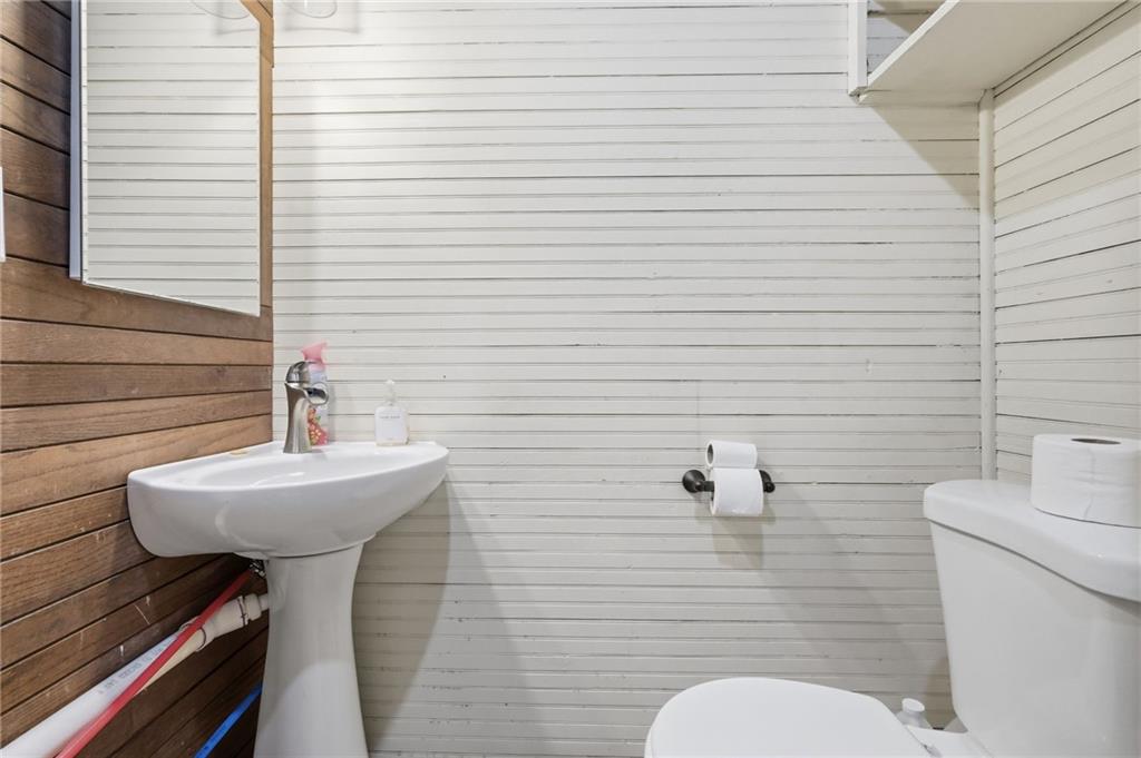 156 Rockdale Road Rockwood, PA 15557 - Photo 16 of 35 a bathroom with a sink a toilet and mirror
