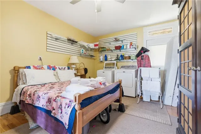 a bed room with a bed and a book shelf