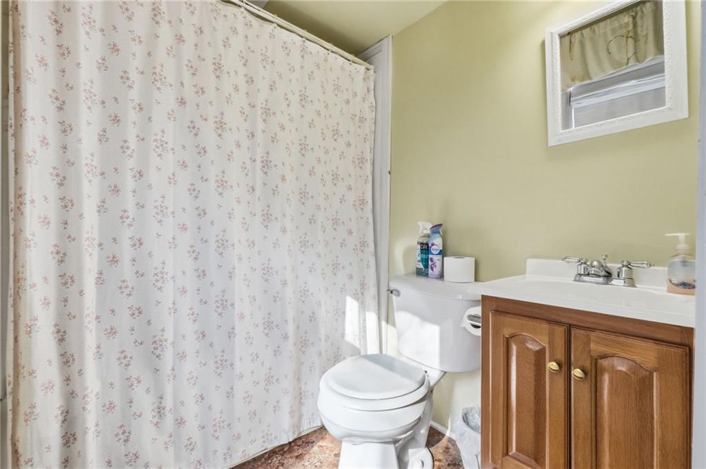 156 Rockdale Road Rockwood, PA 15557 - Photo 20 of 35 a bathroom with a sink toilet and a mirror