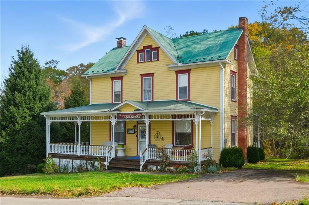 156 Rockdale Road Rockwood, PA 15557 - Photo 2 of 35 a front view of a house with garden